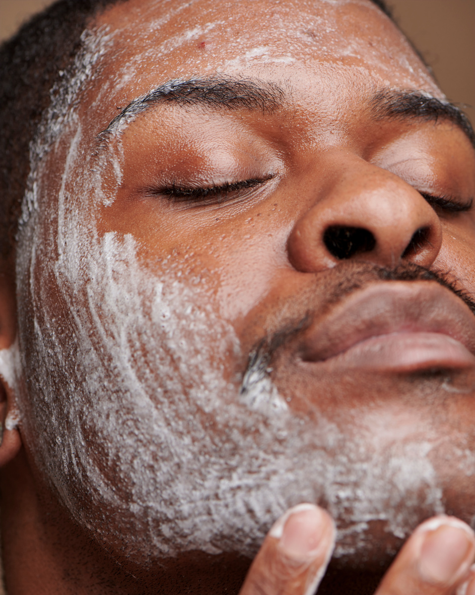 Man Applying Skincare on Face